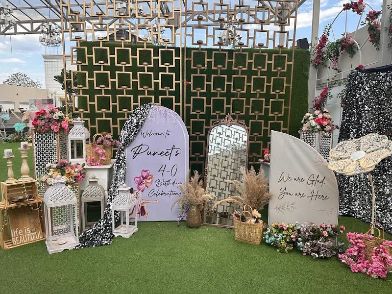 Milestone 40th-birthday outdoor lounge — twin arched backdrops with lattice screen, lanterns, florals and welcome signage — Arya Events Planner, Kharghar, Navi Mumbai