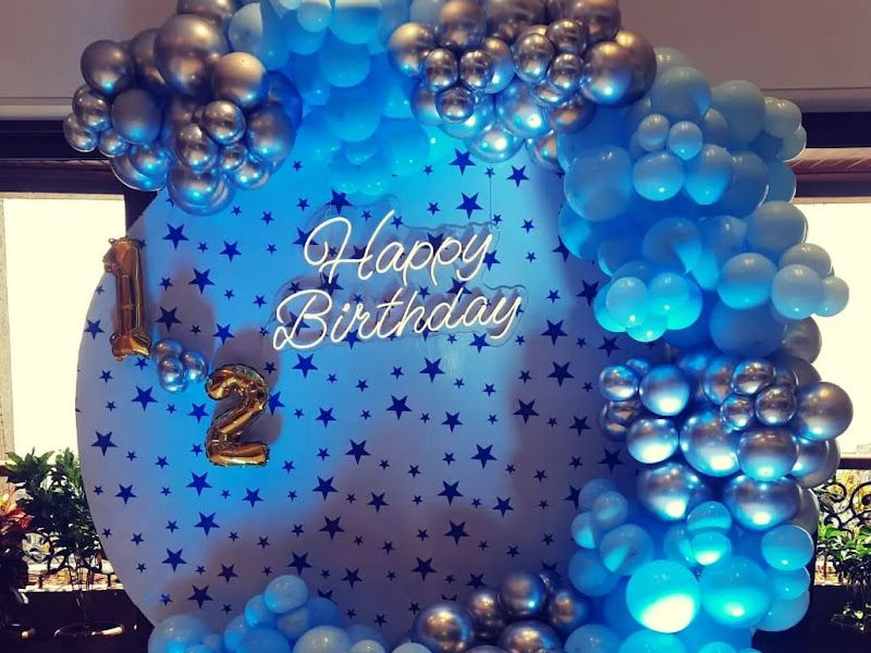 Boy's birthday balloon ring backdrop — blue and silver balloons around a starry 'Happy Birthday' panel with a foil '2' — Arya Events Planner, Kharghar, Navi Mumbai