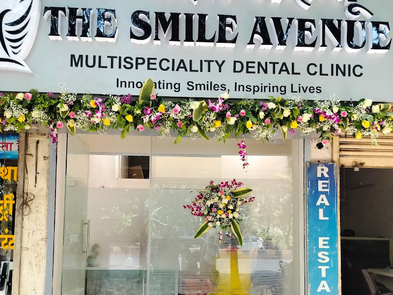 Clinic inauguration decor — floral arrangement and greenery framing a dental-clinic storefront for an opening — Arya Events Planner, Kharghar, Navi Mumbai