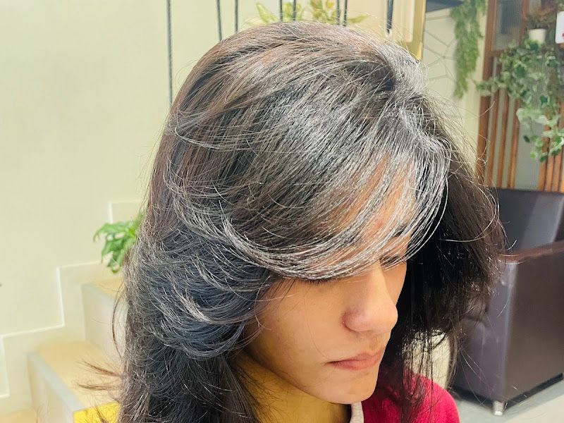 Textured shaggy layered cut with face-framing layers — modern 'wolf-cut' style result. — The Rush Family Salon, Airoli, Navi Mumbai