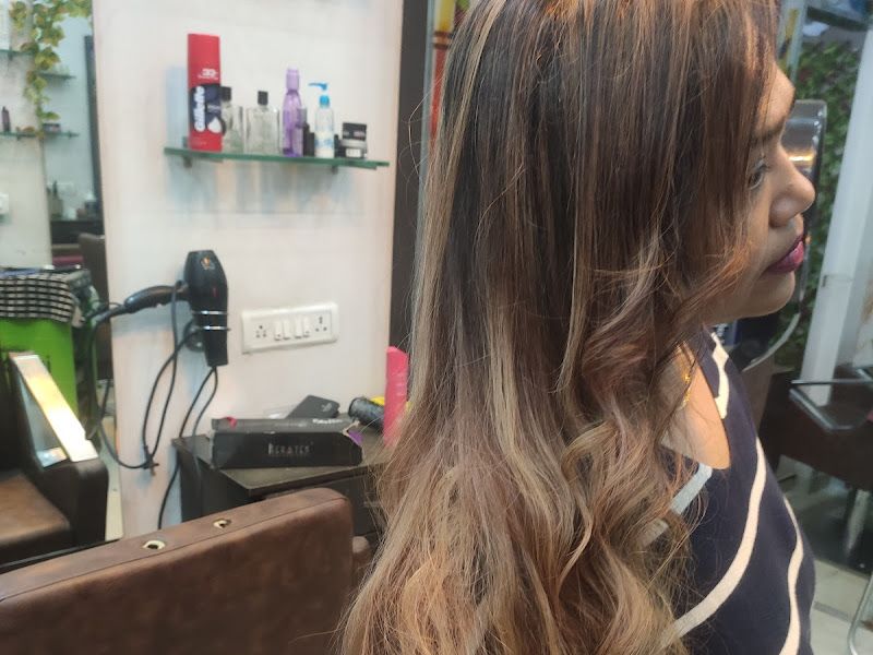 Long balayage/highlighted waves cascading down the back — colour-and-style result at the station. — The Rush Family Salon, Airoli, Navi Mumbai