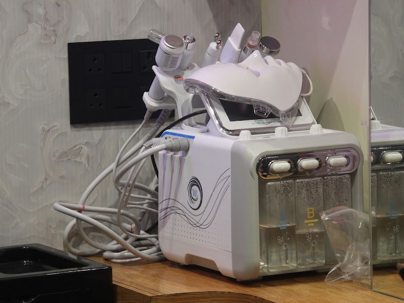 Hydrafacial / facial-treatment machine on the counter — equipment for the salon's facial and skincare services. — The Rush Family Salon, Airoli, Navi Mumbai