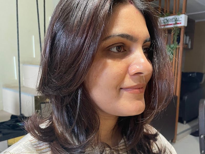 Brunette blow-dry with soft flicked layers, close-up of finished style. — The Rush Family Salon, Airoli, Navi Mumbai
