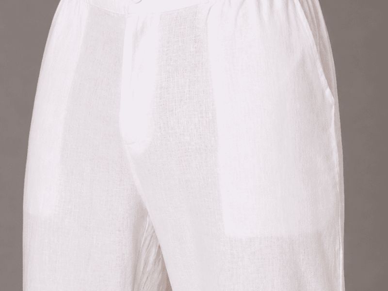 White relaxed cotton-linen trousers — fabric and fit detail. — Vastradrobe, Golf Course Road, Gurgaon