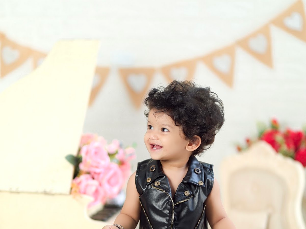 Toddler posing happily at The Happy Snaps photography studio