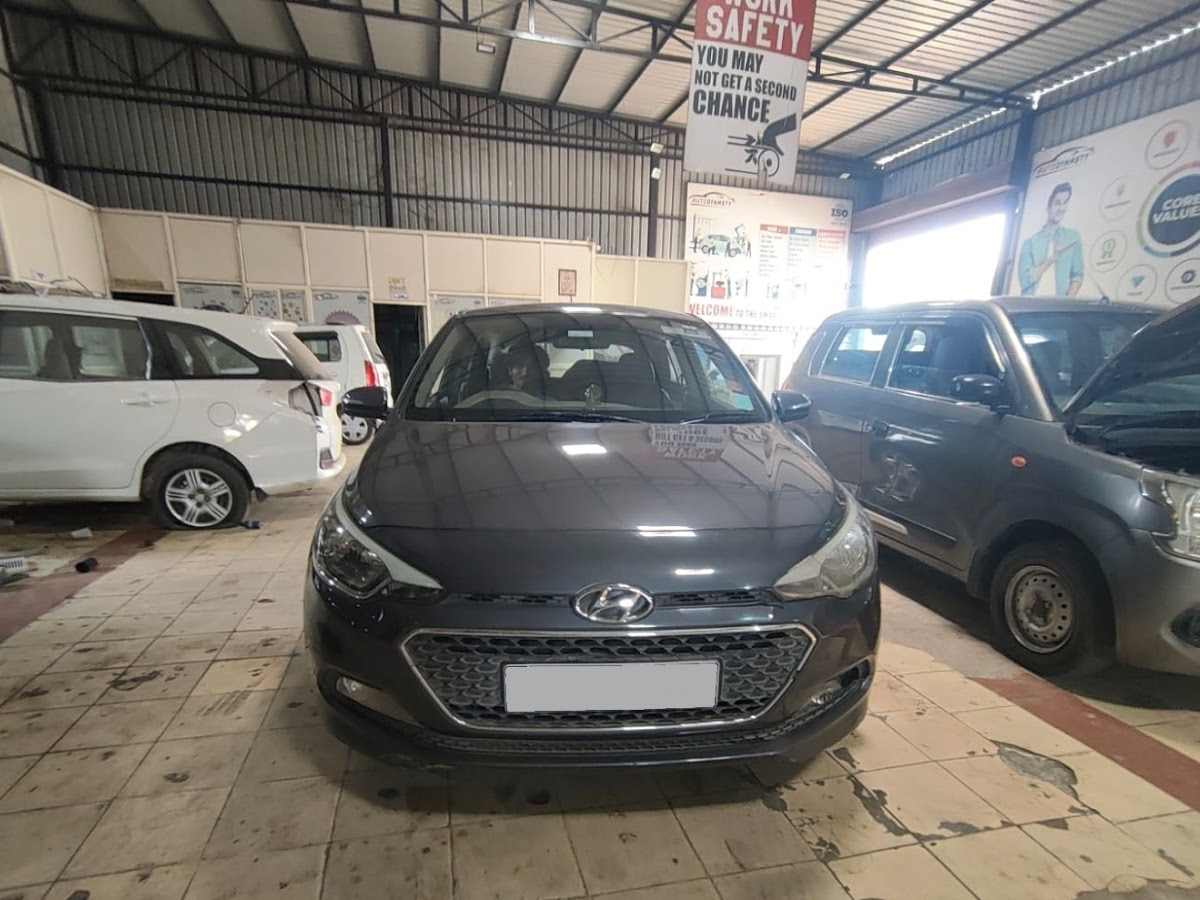 Service bay interior at PrimeLine Auto Care multi-brand garage in Wagholi, Pune