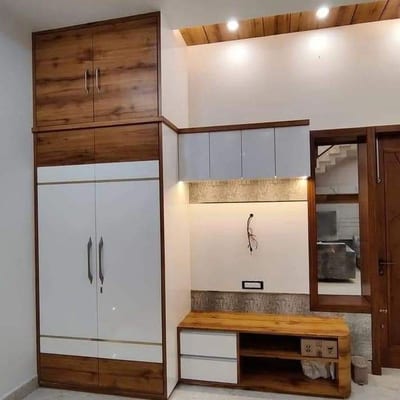 Built-in wooden and white cabinetry with wall-mounted TV panel and open shelving