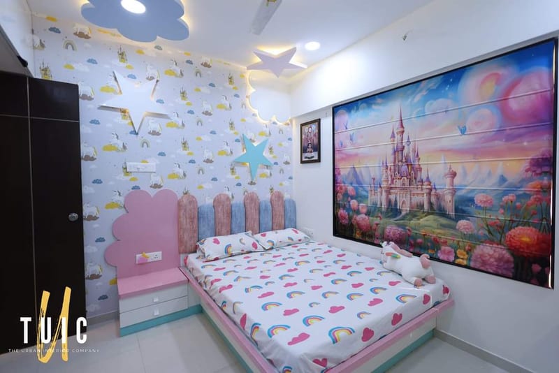 Children's bedroom with pink furniture, rainbow bedding and castle wall mural